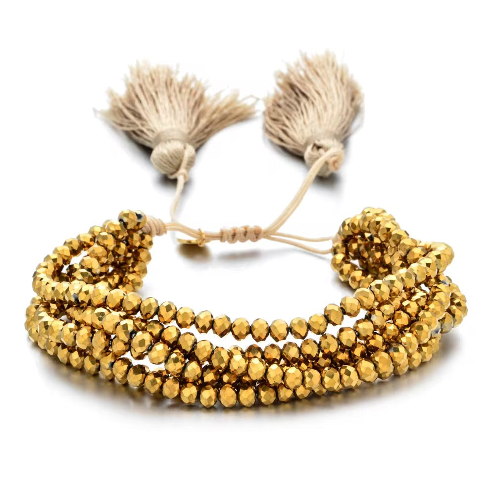 Pulsera Seis Cristales con Pompones