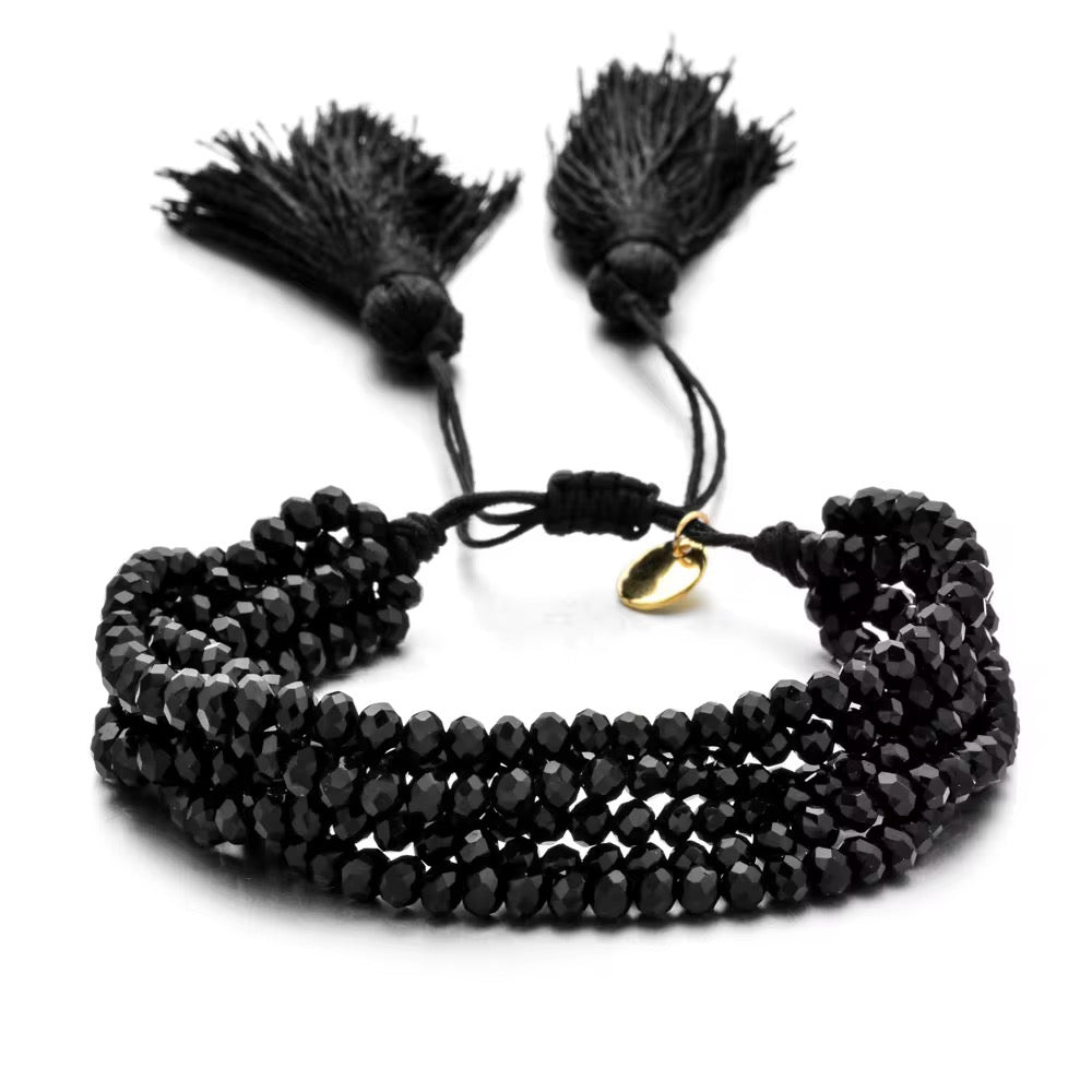 Pulsera Seis Cristales con Pompones