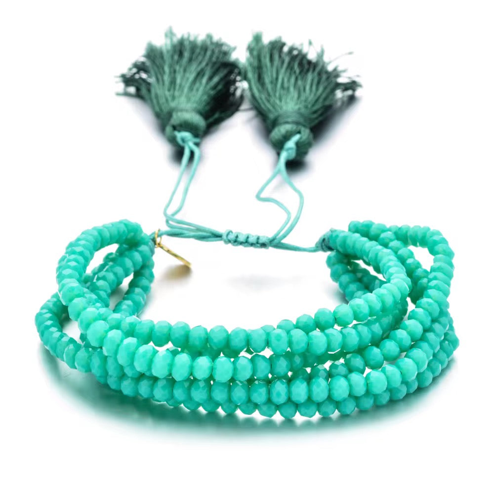 Pulsera Seis Cristales con Pompones