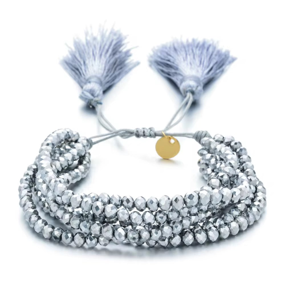 Pulsera Seis Cristales con Pompones