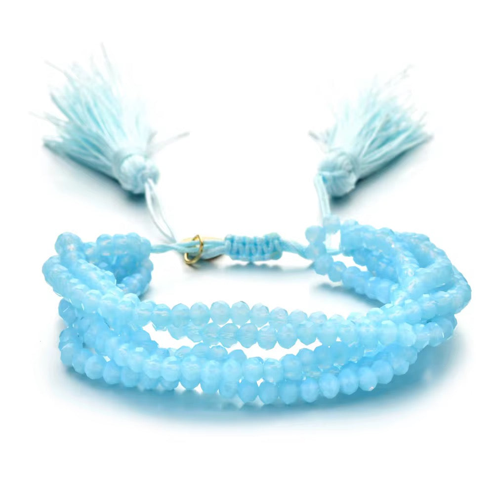 Pulsera Seis Cristales con Pompones