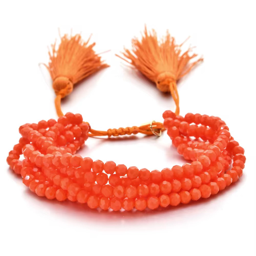 Pulsera Seis Cristales con Pompones